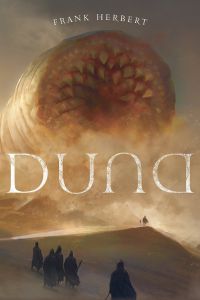 Personagens caminhando em deserto diante de verme gigante